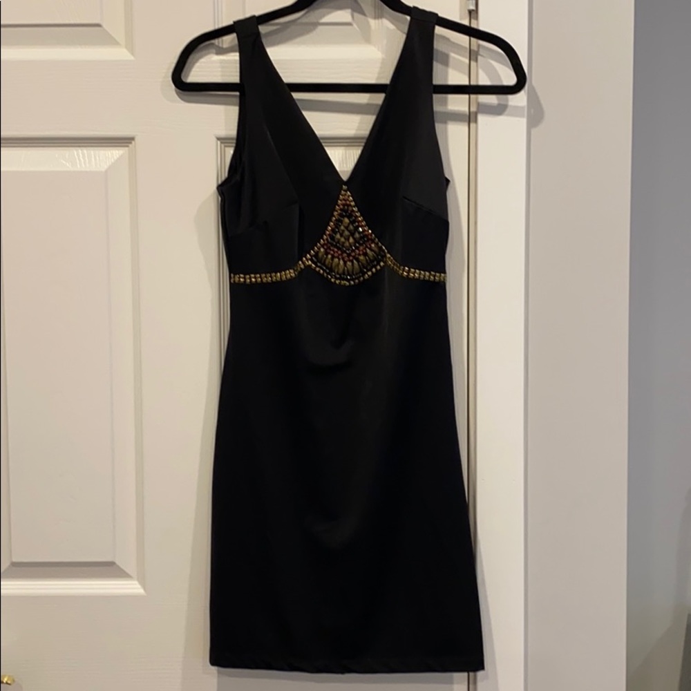 Bebe used once mini dress with a side zipper